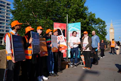 NHS resident doctors hold placards outside St Thomas' Hospital in London, as resident doctors in England, formerly referred to as junior doctors, begin a five-day strike after talks with the government collapsed over pay, Friday, July 25, 2025.