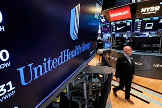 United Health Group logo displayed on NYSE trading floor screen