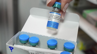 Vials of the measles mumps and rubella (MMR) vaccine are displayed in Lubbock, Texas, on Tuesday, Feb. 25, 2025.