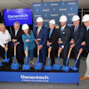 Genentech groundbreaking ceremony with executives holding blue shovels