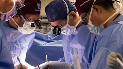 In this photo provided by Mass General Brigham, from left, surgeons Dr. Nahel Elias, Dr. Alban Longchamp, Dr. Tatsuo Kawai and Dr. Shoko Kimura transplant a genetically edited pig kidney into Bill Stewart June 14, 2025 at Massachusetts General Hospital in Boston.