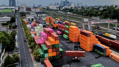 Containers are piled upon a cargo terminal in Frankfurt, Germany, Tuesday, Sept. 9, 2025.