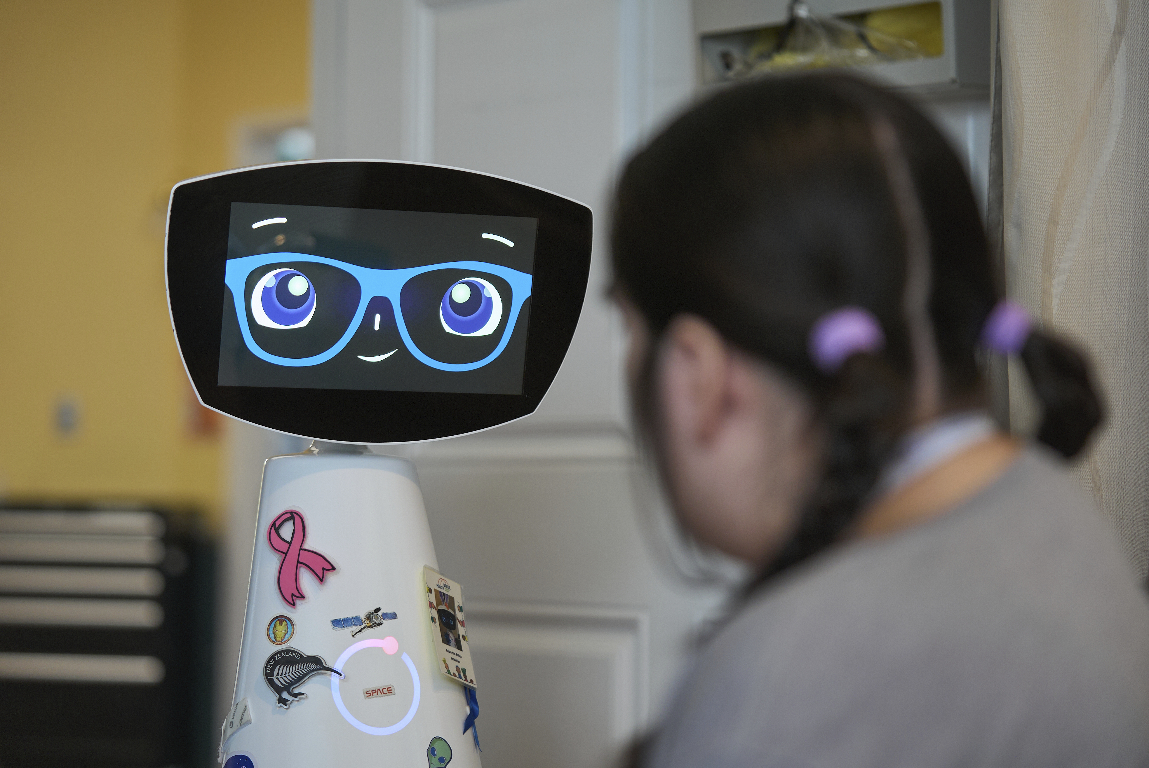 Robin the Robot visits with a patient at the HealthBridge Orange Specialty Pediatric Hospital in Orange, Calif., on Friday, Sept. 12, 2025.