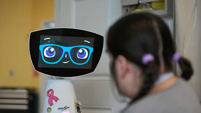 Robin the Robot visits with a patient at the HealthBridge Orange Specialty Pediatric Hospital in Orange, Calif., on Friday, Sept. 12, 2025.