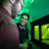 Mechanical engineering master’s students Reese Rodely (left) and Kamal Kunwar discuss what they are observing in SIU Carbondale’s 3D metal printer.
