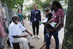 Dr. Inaki Bent, right, talks with Jonas Richards, left, while working with the Miami Street Medicine team to provide medical services to homeless people, Saturday, Aug. 23, 2025, in Miami.