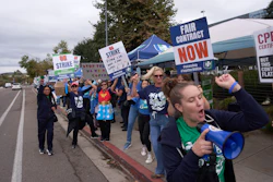 Kaiser Permanente health care workers hold signs and chant slogans while on strike in front of the Kaiser Permanente San Diego Medical Center Tuesday, Oct. 14, 2025, in San Diego.