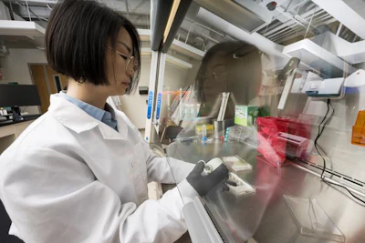 Biomedical engineering PhD student Kaihua Chen, a member of URochester professor James McGrath&rsquo;s team, prepares tissue chips for experiments.