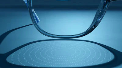 In this photo provided by EssilorLuxottica in October 2025, refractions caused by lenslets embedded in the company's Stellest eyeglass lens are projected onto a table.
