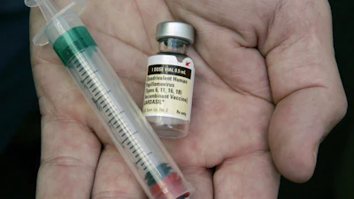 A doctor holds a vial of the human papillomavirus (HPV) vaccine Gardasil in Chicago on Aug. 28, 2006.