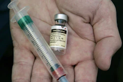 A doctor holds a vial of the human papillomavirus (HPV) vaccine Gardasil in Chicago on Aug. 28, 2006.