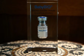 Medical vial of BabyBIG immune globulin in glass display case
