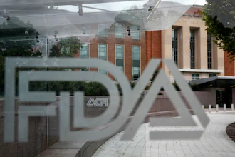 FDA logo on glass surface with government building in background