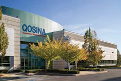 Qosina corporate headquarters with blue signage, modern building exterior and autumn trees