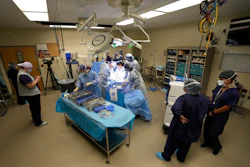 An organ recovery team works to remove the liver and kidneys from a donor June 15, 2023, in Jackson, Tenn.