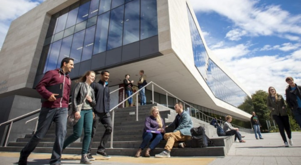 Students Outside Building On Campus (1)