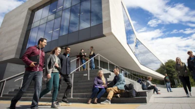 Students Outside Building On Campus (1)