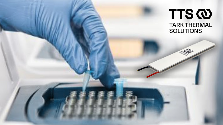 Gloved hand pipetting sample into thermal testing equipment