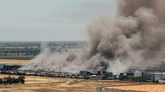 Smoke is seen from the massive fire at the Medline medical supply warehouse in Tracy, Calif., Friday, June 12, 2026.