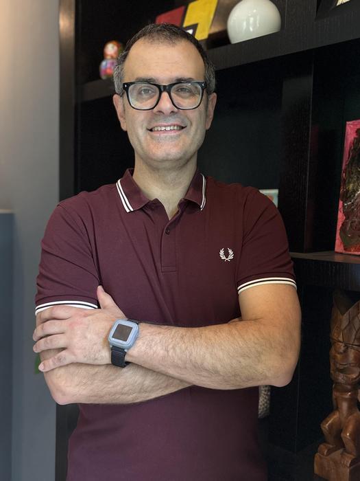 Benjamin Sanchez Teronnes wearing a prototype of the wearable device he developed for monitoring blood pressure.