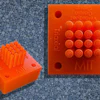 MIT researchers have demonstrated a low-cost design of specialized electronic nozzles, called triaxial electrospray emitters (pictured here), that could be used to manufacture time-release drug-delivery particles or self-healing materials.