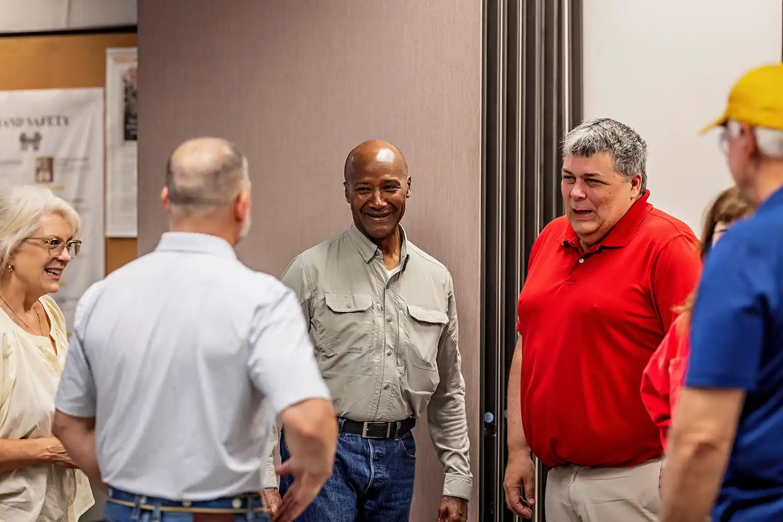 Retired Major General Mike Talley (center) met last month in Chillicothe with U.S. Paper Mill executives, including Michelle Tolliver (left) and Bob Stanley (right).
