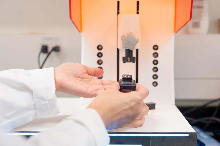 A close-up of the 3D-printed contact lens on the printing platform in University of Waterloo&rsquo;s Tang Nanotechnology Lab.