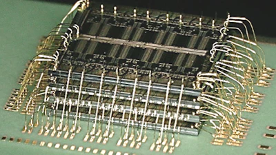 A stacked die assembly with waterfall wirebonds produced at Promex. Packing multiple die vertically within a tight mechanical envelope requires every material and process variable — spacer thickness, die attach film bondline, wire bond arc height — to be engineered as a system, not selected independently.