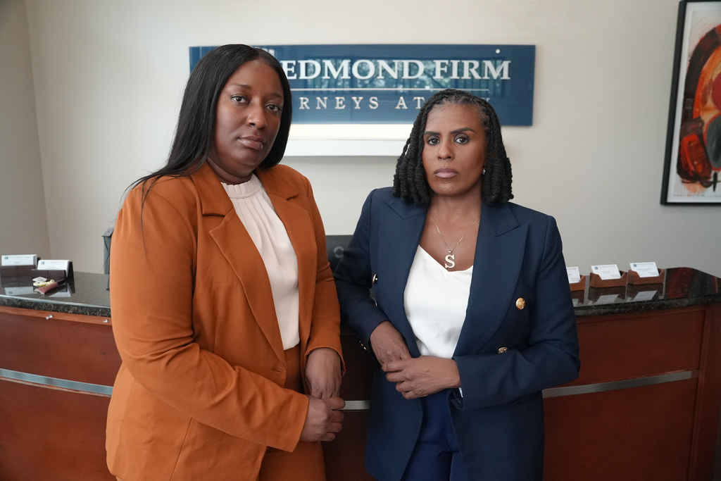 Cassandra Barksdale, left, who says she was wrongly diagnosed with cancer due to a tissue labelling mistake, poses with her lawyer Shannan Young in Atlanta, Ga., Thursday, Aug. 6, 2026.