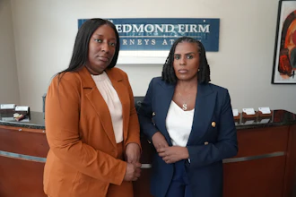 Cassandra Barksdale, left, who says she was wrongly diagnosed with cancer due to a tissue labelling mistake, poses with her lawyer Shannan Young in Atlanta, Ga., Thursday, Aug. 6, 2026.