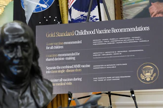 A sign about childhood vaccines is pictured as President Donald Trump speaks during a meeting to sign an executive order, Monday, Aug. 10, 2026, in the Oval Office of the White House in Washington.