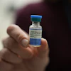 Dr. Jessica Early holds a vial of the combination measles, mumps and rubella vaccine at Prisma Health Pediatrics in Greer, S.C., March 18, 2026.