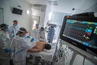 Doctors and nurses wearing protective gears attend a patient on ventilator at the intensive care unit of Szent Laszlo Hospital treating COVID-19 patients during the pandemic of new coronavirus COVID-19 in Budapest, Hungary, on Dec. 13, 2021.
