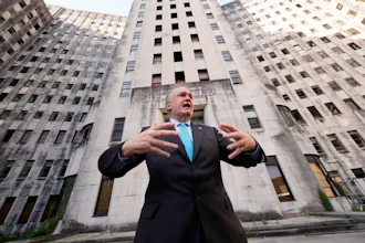 Tulane University president Michael A. Fitts talks outside the old Charity Hospital building Wednesday, Aug. 19, 2026, in New Orleans.