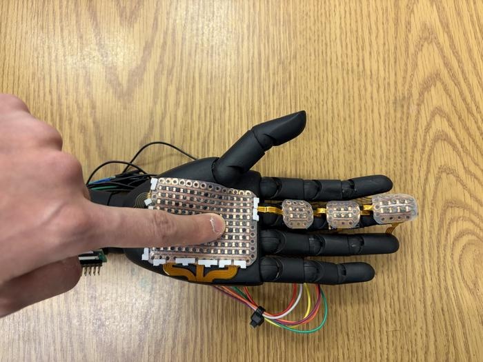 A robotic hand fitted with 3D-printed sensor module developed by the research team from Washington State University. The electronic skin can detect pressure and temperature at a fine level, laying the groundwork for bionic skin that could be used on prosthetics to help amputees and others.
