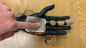 A robotic hand fitted with 3D-printed sensor module developed by the research team from Washington State University. The electronic skin can detect pressure and temperature at a fine level, laying the groundwork for bionic skin that could be used on prosthetics to help amputees and others.