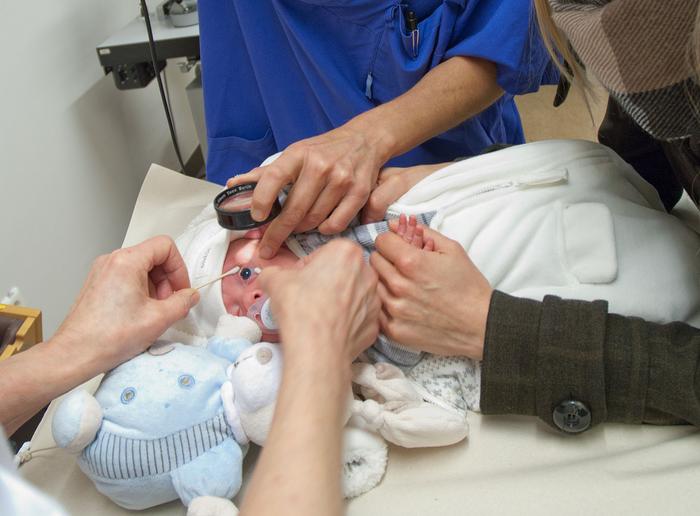 A premature baby is examined for the eye disease Retinopathy of prematurity (ROP).