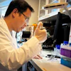 Xinxin Liu prepares a newly-fabricated nanopore membrane for evaluation. The new method simplifies production of large arrays of nanopores for sensing and analysis technologies used in medical research and, increasingly, in specialized clinics.