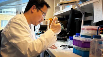 Xinxin Liu prepares a newly-fabricated nanopore membrane for evaluation. The new method simplifies production of large arrays of nanopores for sensing and analysis technologies used in medical research and, increasingly, in specialized clinics.