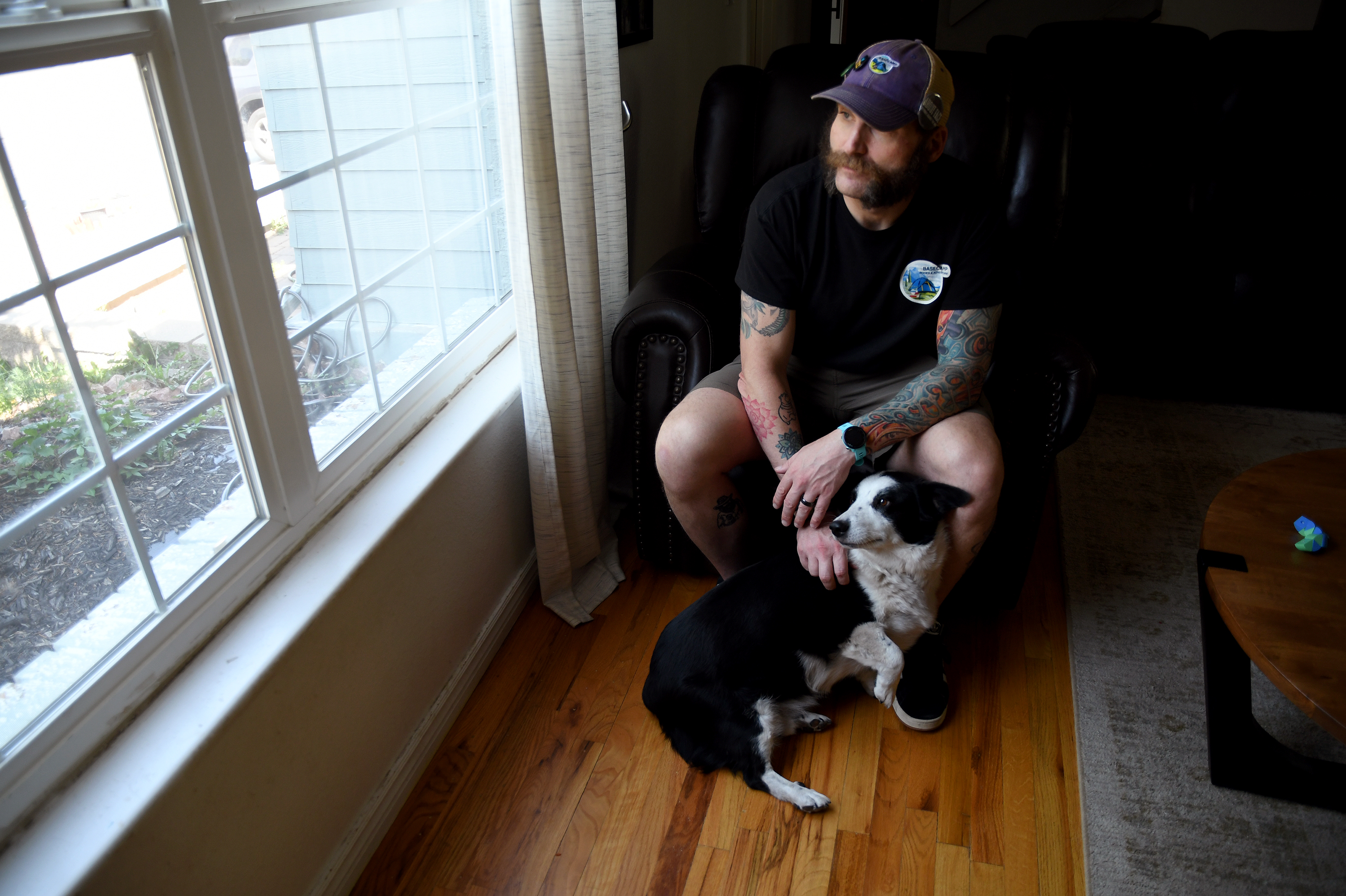 Joe Shearer, who was recently diagnosed with traumatic brain injuries from fighting in Iraq, poses for a portrait in his home in Colorado Springs, Colo., Wednesday, Aug. 5, 2026.