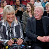 Phil Knight, right, and Penny Knight, watch the first half of an NCAA college basketball game in the Phil Knight Invitational tournament in Portland, Ore., on Nov. 26, 2017.