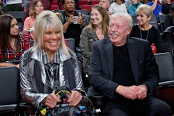 Phil Knight, right, and Penny Knight, watch the first half of an NCAA college basketball game in the Phil Knight Invitational tournament in Portland, Ore., on Nov. 26, 2017.