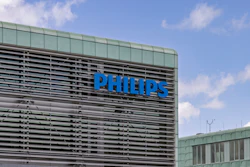 Philips blue lettering on modern office building facade with horizontal louvers and glass panels