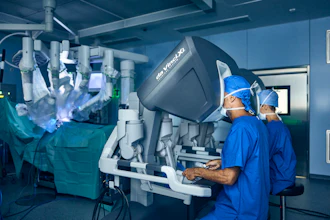Surgeons operating da Vinci robotic surgical system in sterile operating room with monitors displaying procedure