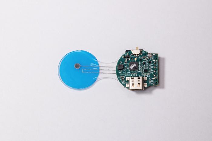 The HELP patch integrates porous flexible input/output connectors and a miniature wireless printed circuit board.