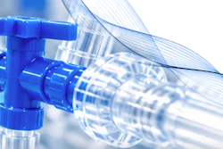 Blue plastic valve with transparent tubing and water droplets against white background