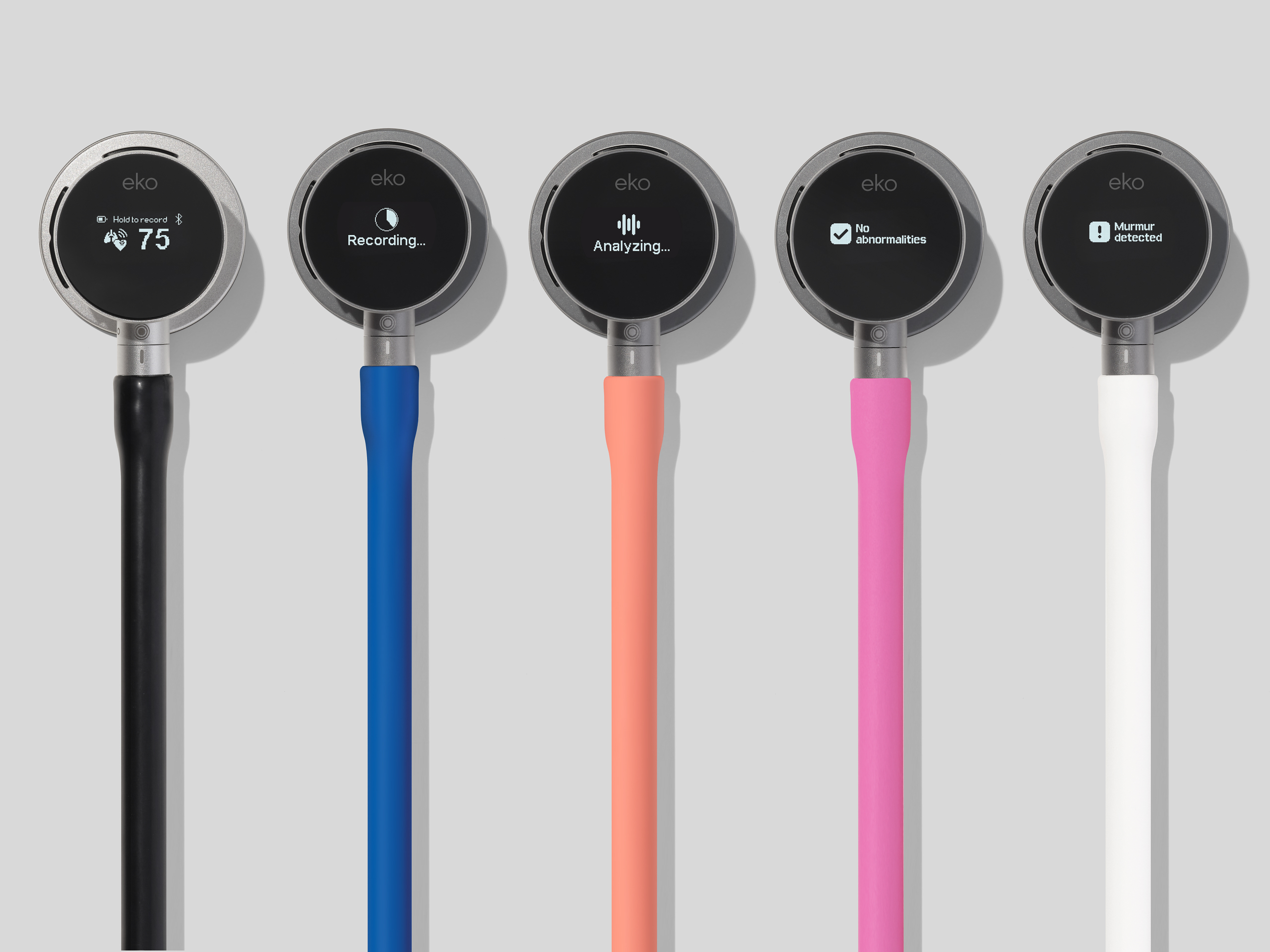Five Eko handheld devices with colored handles displaying different functions: temperature, recording, analyzing, documentation, and learning modes.