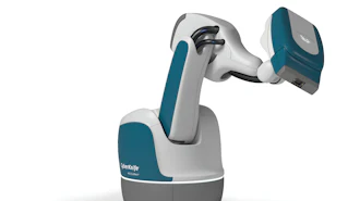 Stäubli collaborative robotic arm with teal and white design featuring articulated joints and gripper end-effector