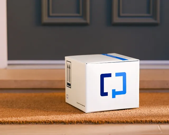 White Zapier product box with blue logo on wooden floor in modern interior