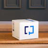 White Zapier product box with blue logo on wooden floor in modern interior